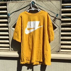 Yellow Nike logo shirt